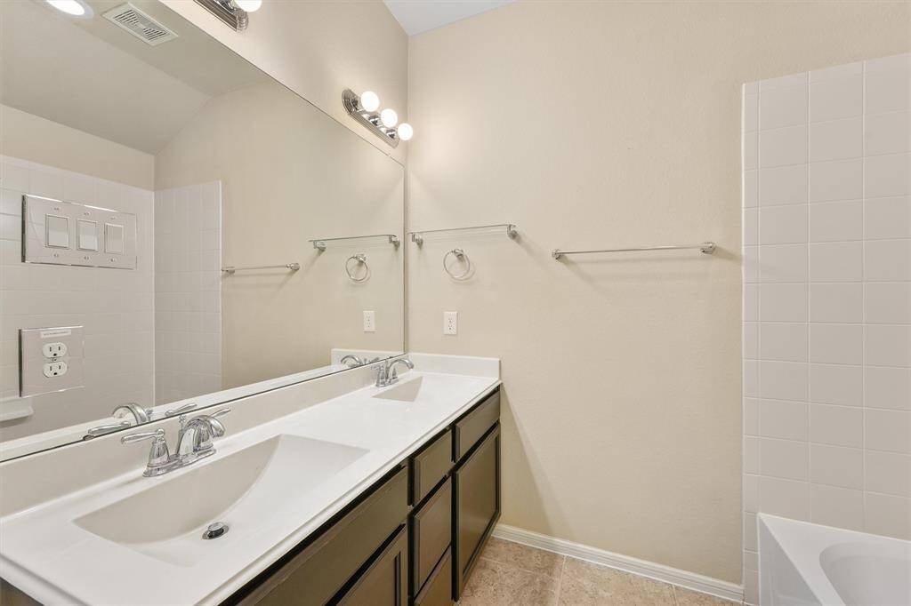 Third bathroom with double sinks