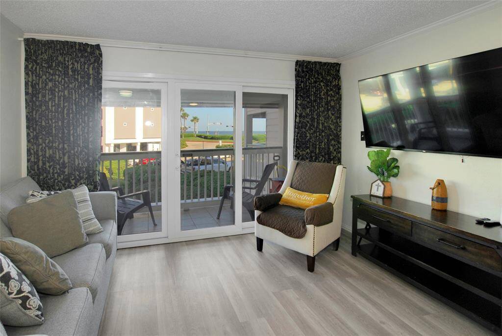 The living space is bright and airy with Gulf views from living room.