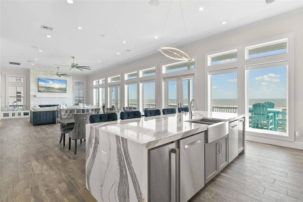 Sleek, stylish, and functional—this kitchen boasts a farmhouse-style apron sink, bar-style seating, custom-installed icemaker and a whisper-quiet 1-horsepower garbage disposal, creating the perfect balance of beauty and efficiency.