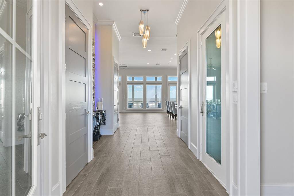 As soon as you step through the front door, you're greeted with a breathtaking, unobstructed view of the coast. The stunning design of this home ensures the beauty of the beach is the first thing you see.