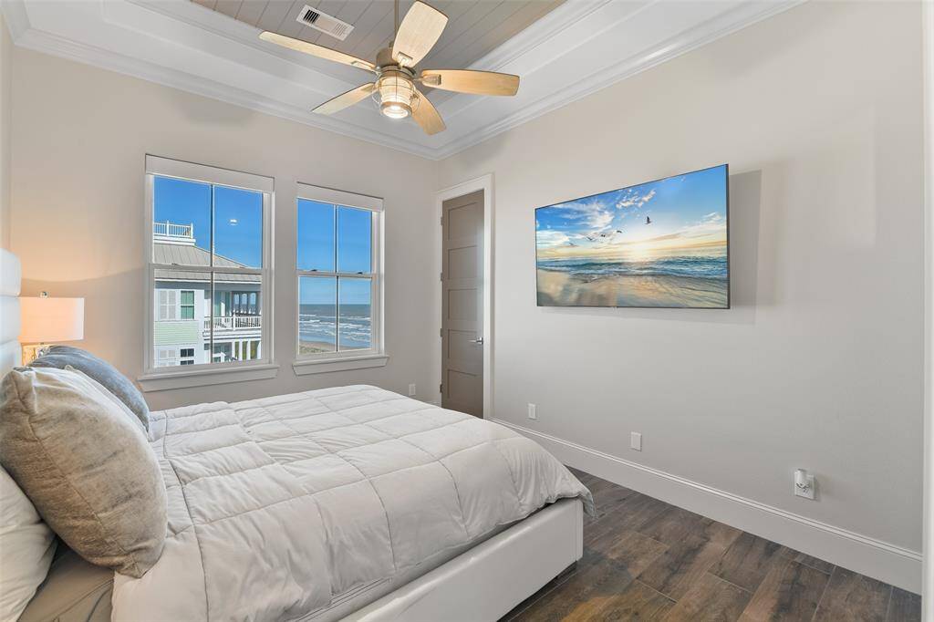 This eastside bedroom offers the perfect spot to watch the sunrise, with stunning views that fill the room with natural light and coastal beauty each morning.