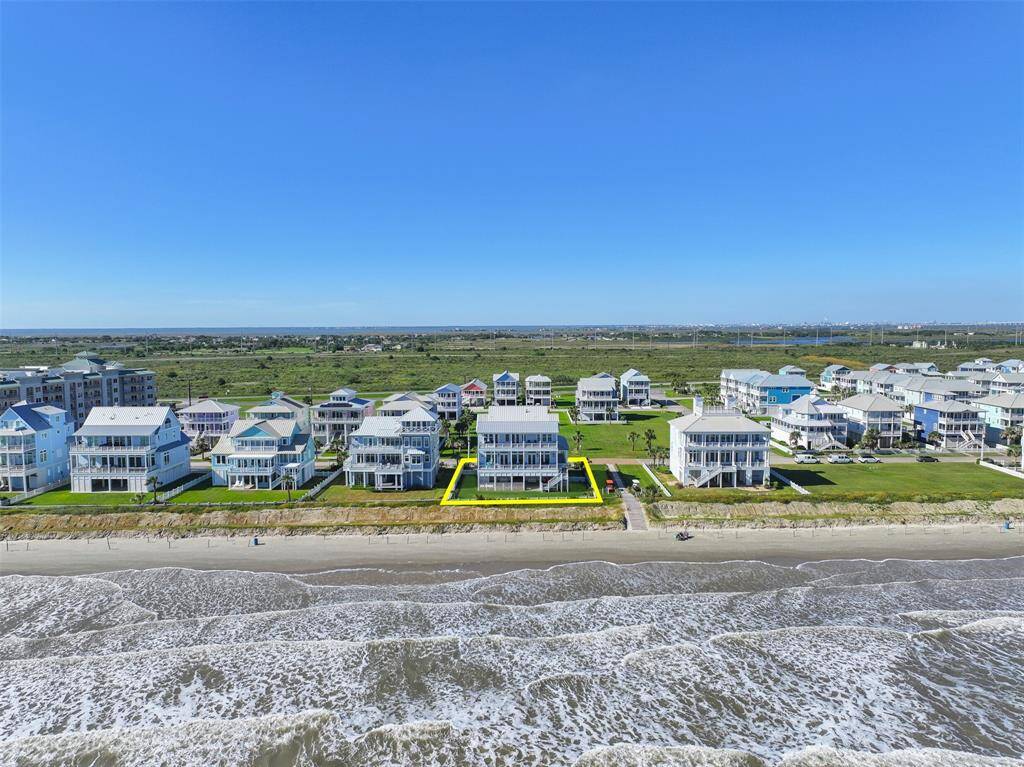 Positioned directly on the beach, this luxurious coastal retreat offers unbeatable oceanfront living with sweeping views of the Gulf. Imagine waking up to the sound of the waves and having the sandy shores just steps from your backdoor—an absolute dream for any beachfront homeowner.