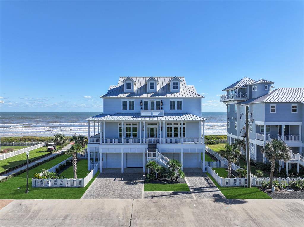 Discover unparalleled beachfront living in this custom-built haven! With sweeping ocean views from over 2,000 square feet of covered porches, a hand-laid paved driveway, a fully upgraded landscaping package & irrigation system and unobstructed beach access, this exquisite home is the ultimate coastal retreat. Park and drive on the beach any time of the day or night.