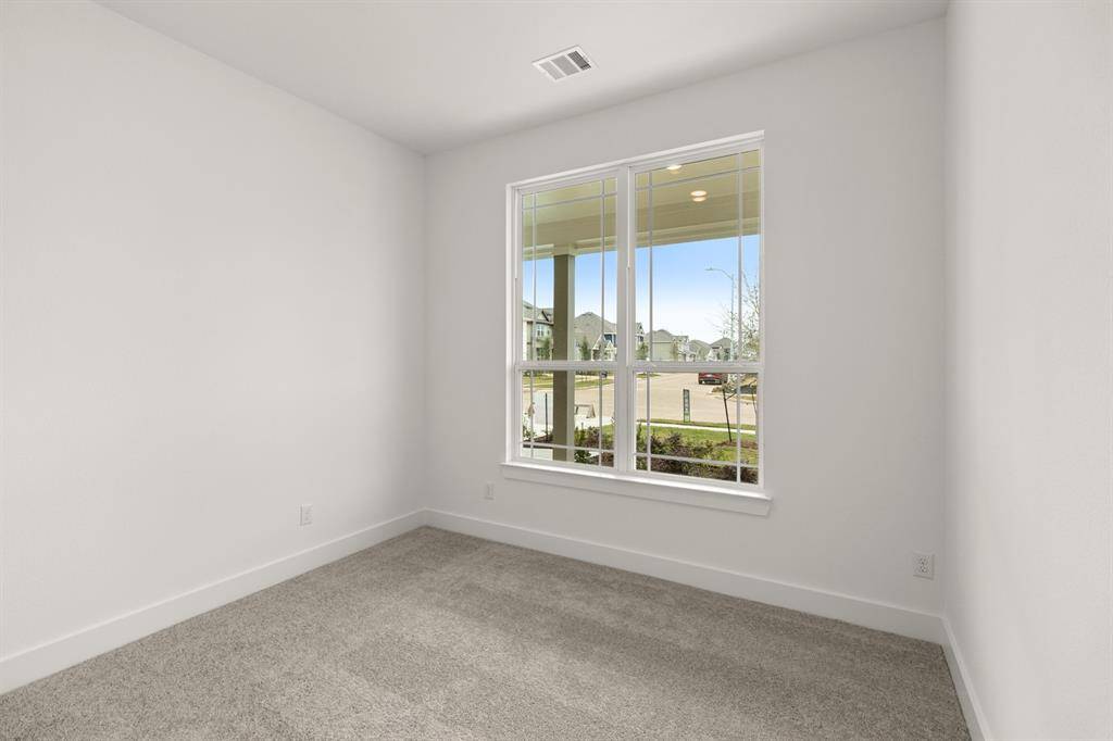 The front bedroom offers a private retreat, complete with its own en-suite bathroom for ul