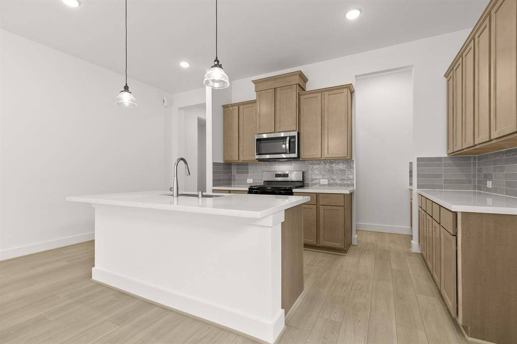 A walk-in butler’s pantry provides ample storage and organization, making meal prep and en