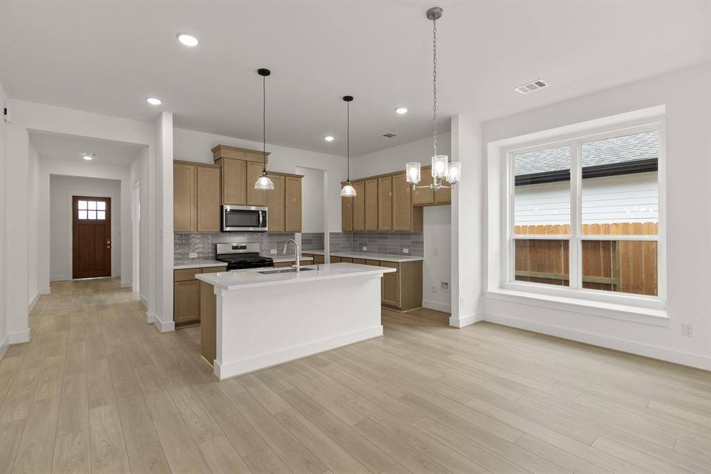 With its seamless layout, the kitchen flows effortlessly into the dining and living spaces