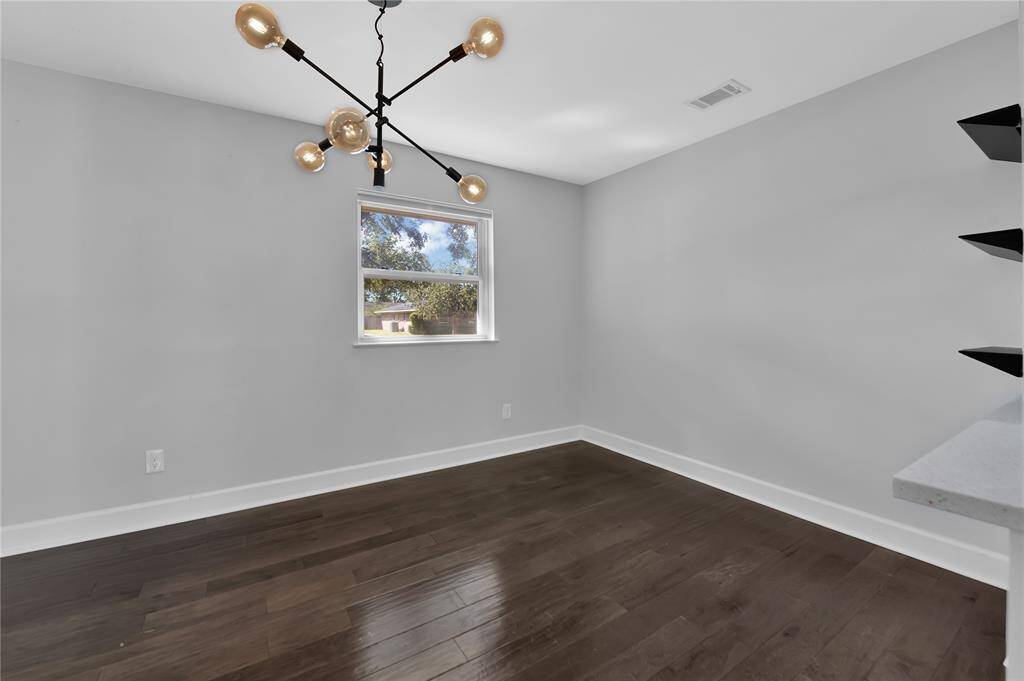 Chic dining space featuring sleek built-ins and designer lighting.
