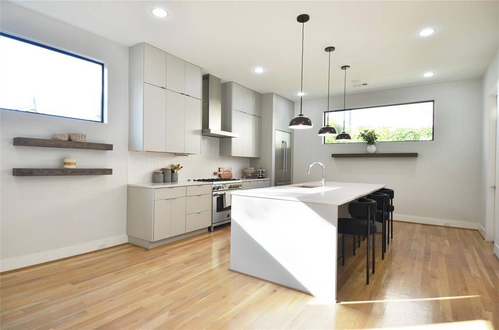 Amazing views on the second floor of the beautiful wood floors and oversized waterfall island.
