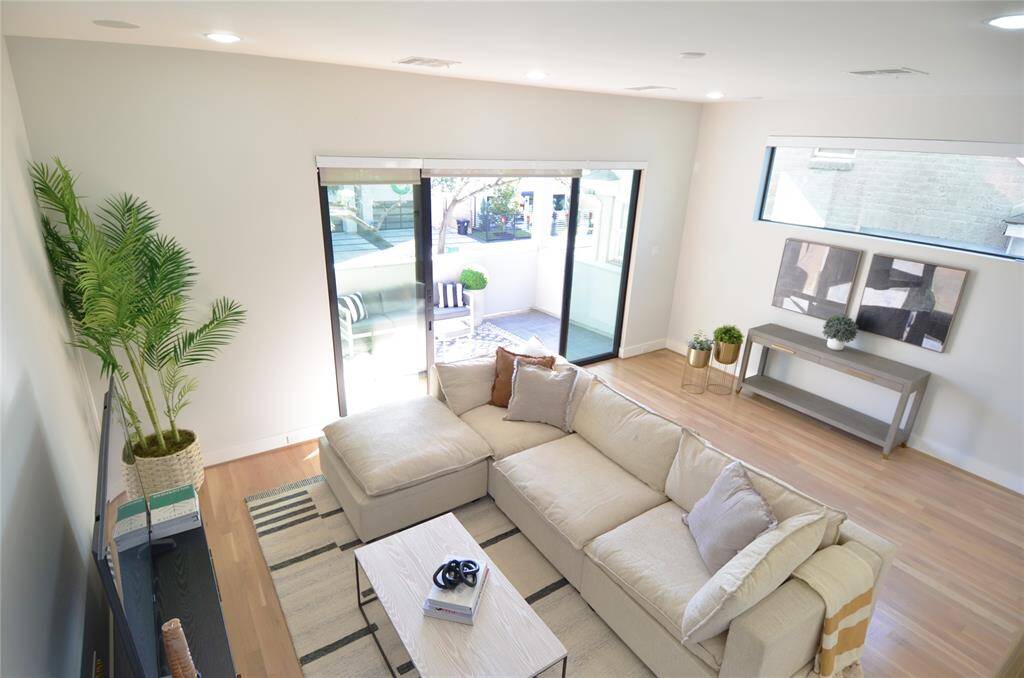 Grand living area with outdoor entertaining paito on second floor.