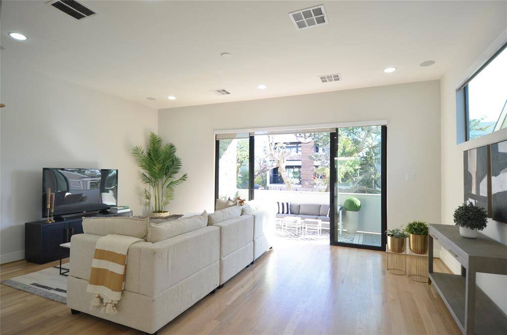 Amazing living room with open patio entertaining as well.