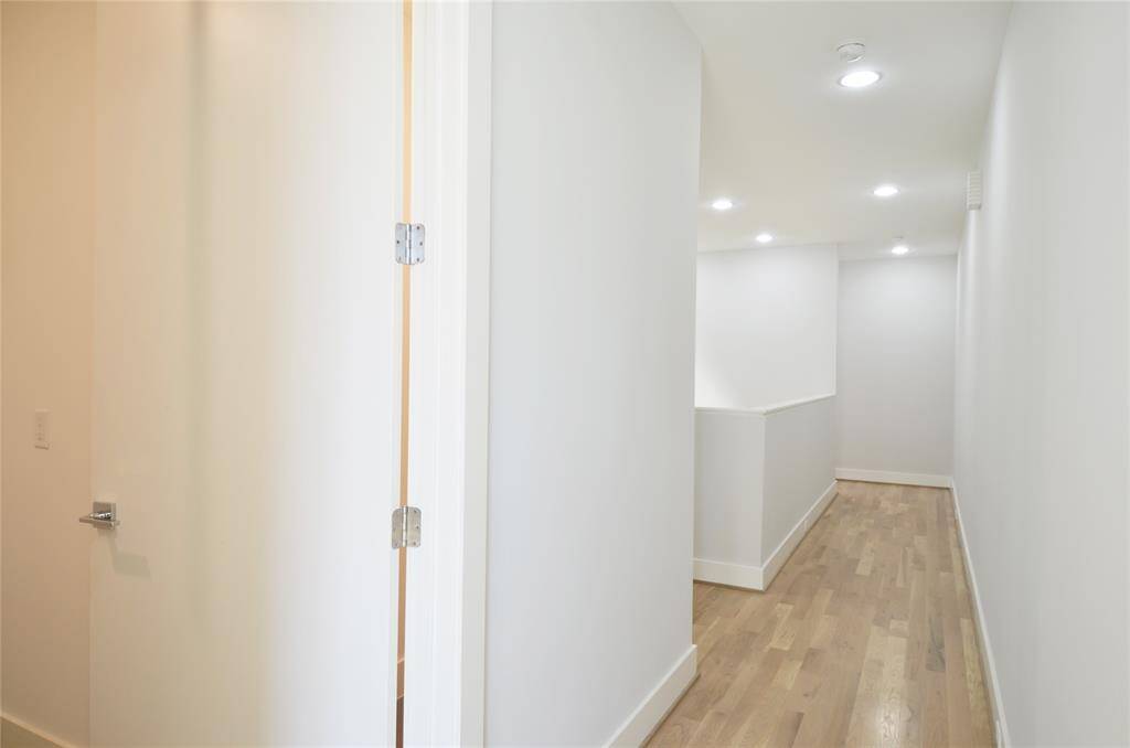 Hall way on third by utility room.