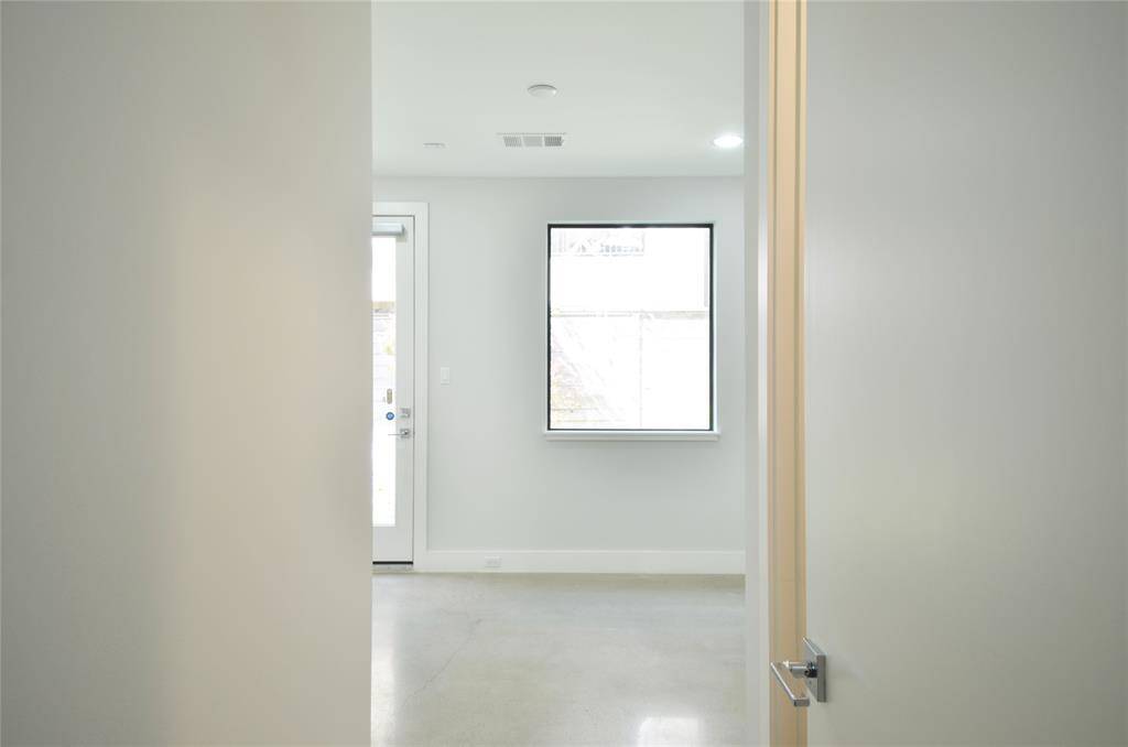 Looking into the bedroom that leads into the backyard--closet behind door on right.