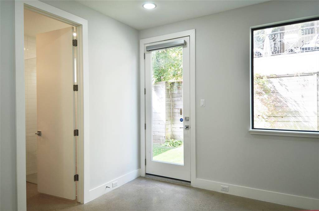 Another angle of same bedroom that leads out to backyard.