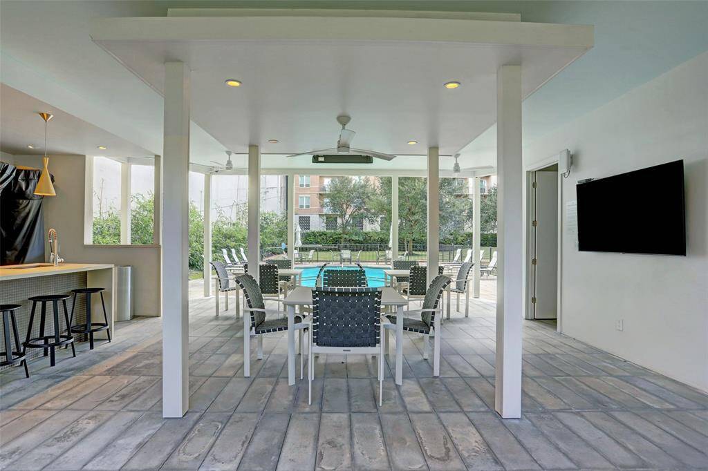 Outdoor entertaining space with flat screen TV, Kitchen area.