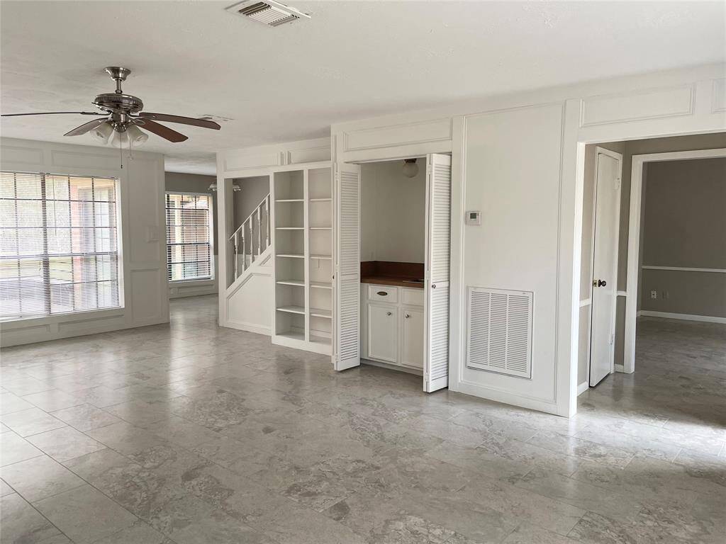 Huge Living Room with lots of light and wet bar