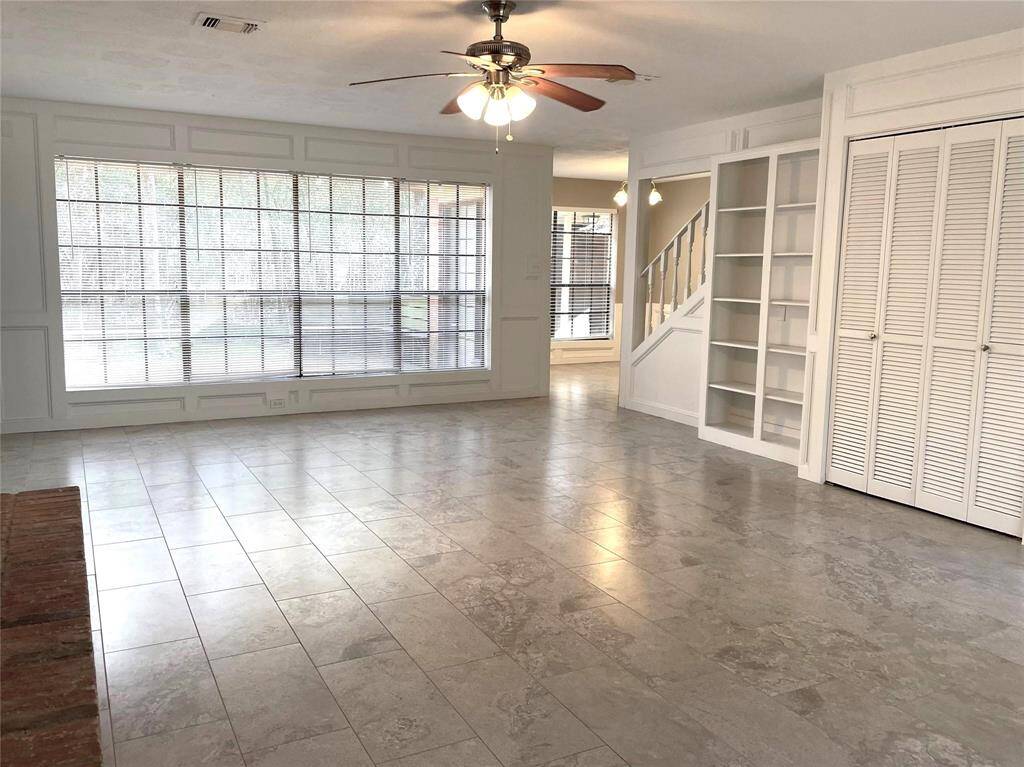 View of Living Room with wet bar doors closed