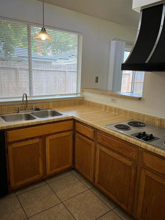 Kitchen has refrigerator