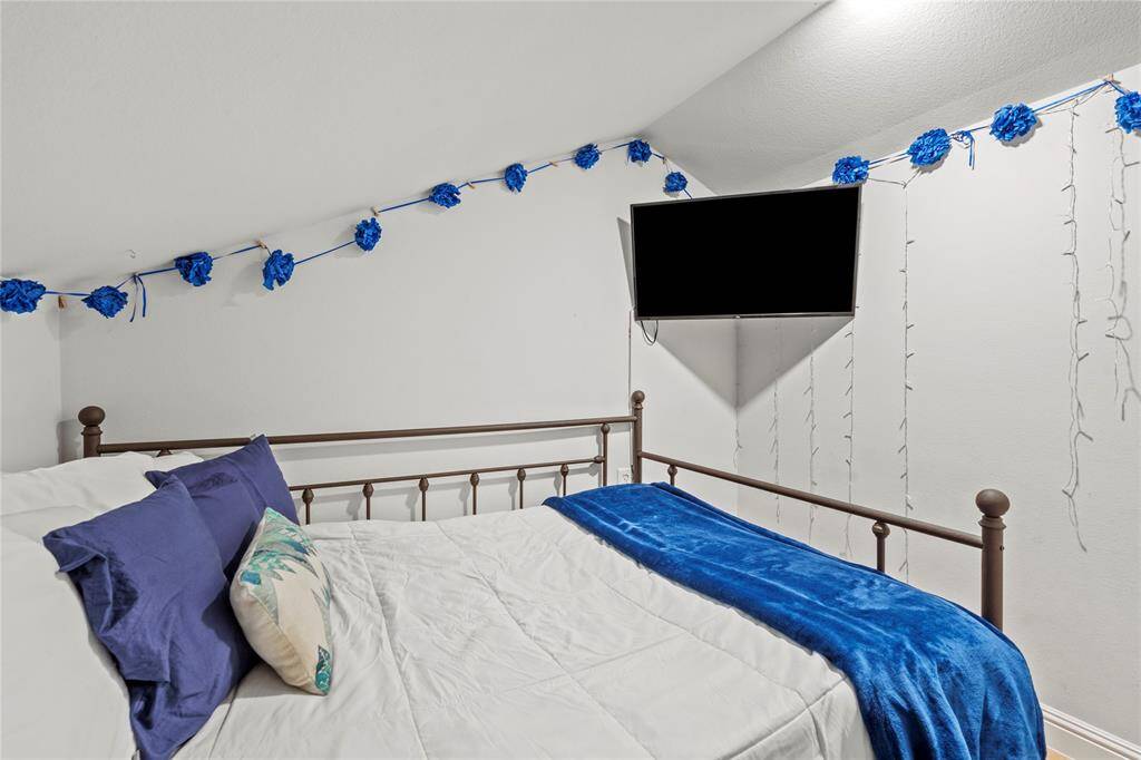 Conveniently adjacent to the living space, discover the comfort of a versatile sanctuary.