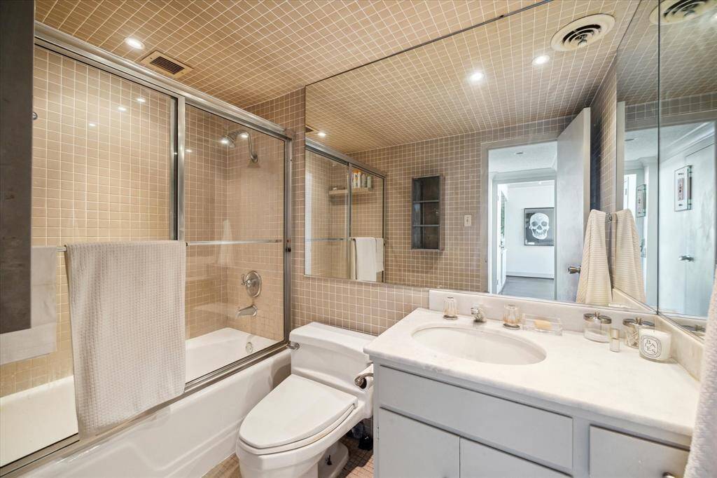 Completely tiled Bathroom Floor to Ceiling.
