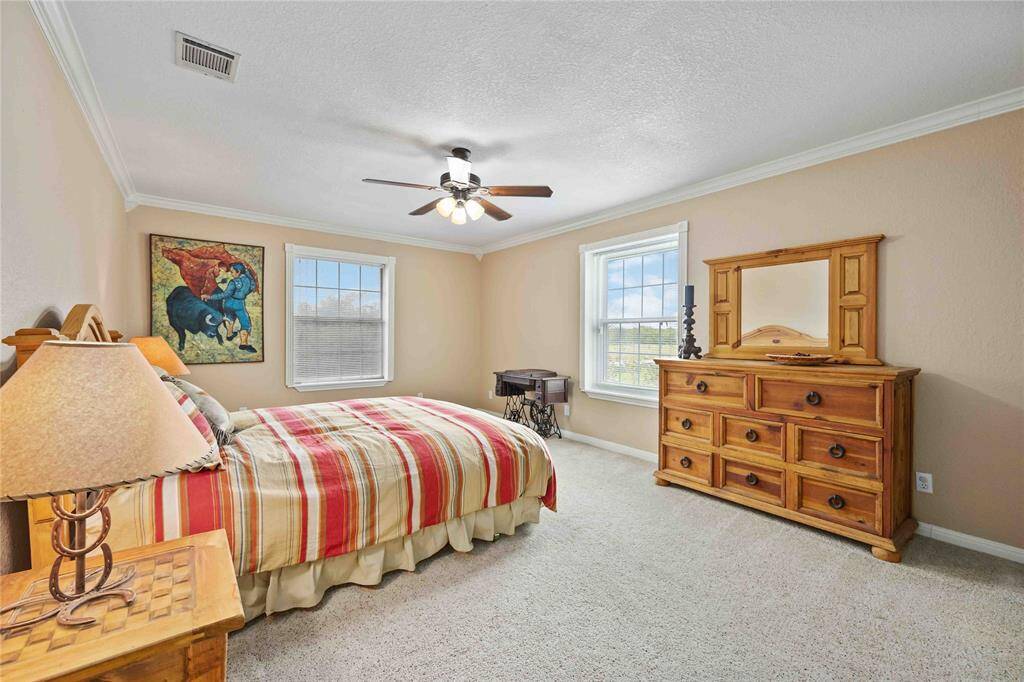 Each room in the main house is attached to a full bathroom.  They all have crown molding and ceiling fans.