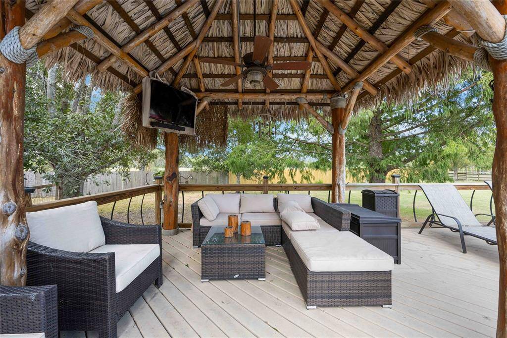 The poolside palapa offers a place to watch your favorite game and cool down with the nice breeze from the fan.