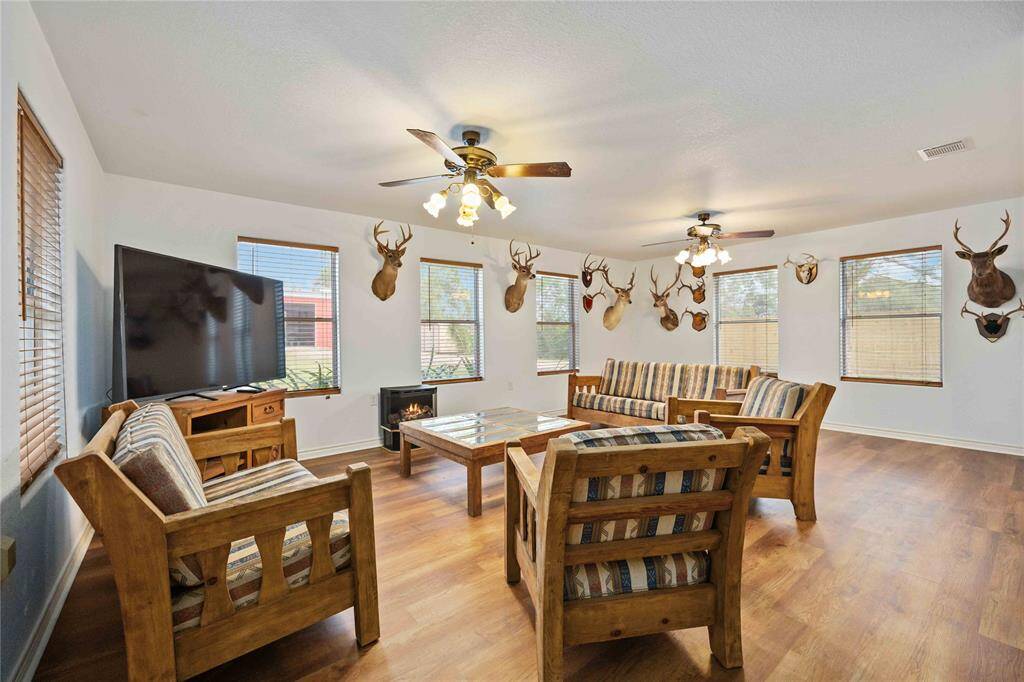 The guest house living room is 23 x 15.  Great for a small gathering or just to have some extra space.  The guest house is 1,400 square foot.