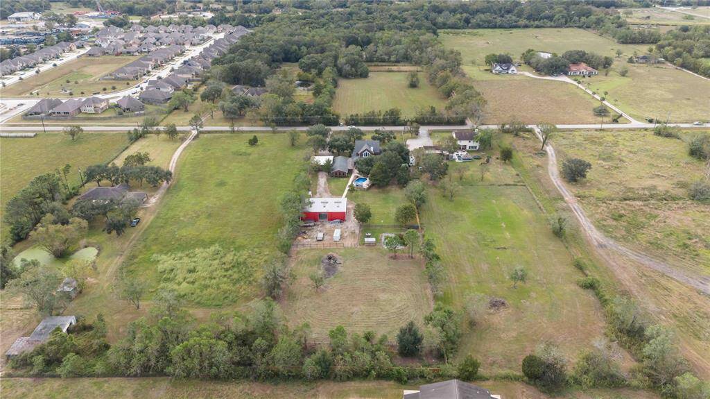 An overhead view of the backside of the property.  Plenty of room for animals.