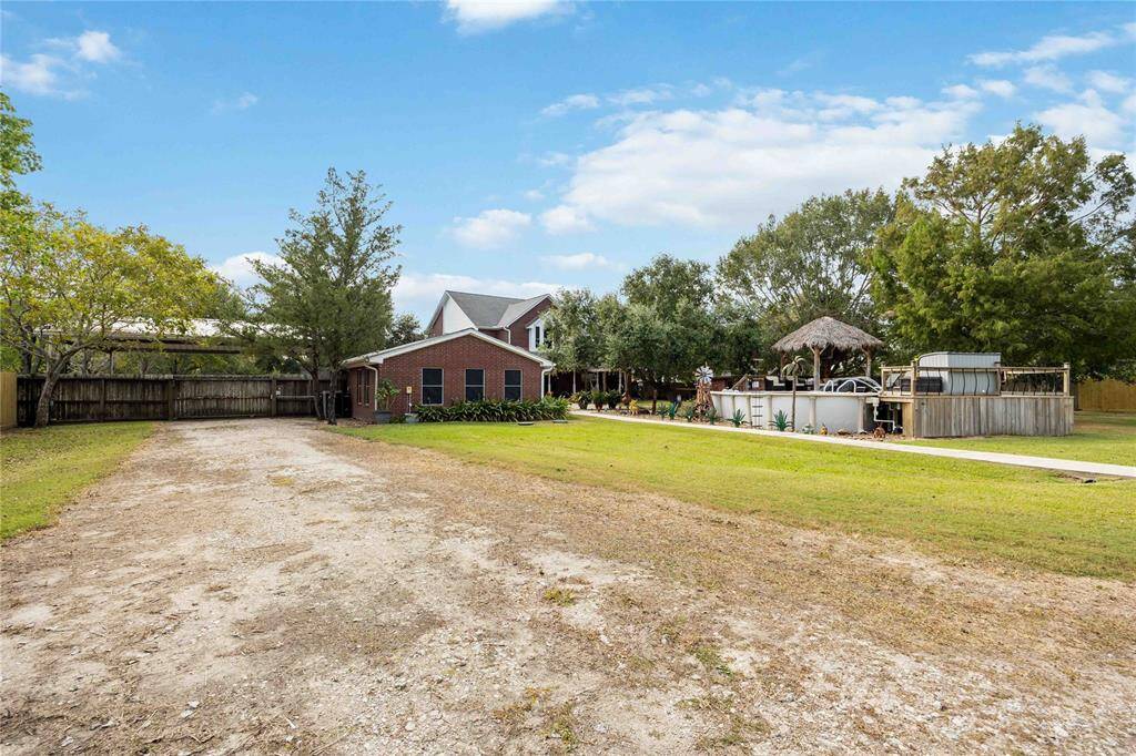 There is a gravel drive from the carport all the way around the barn, as well as a concrete sidewalk from the house to the barn.