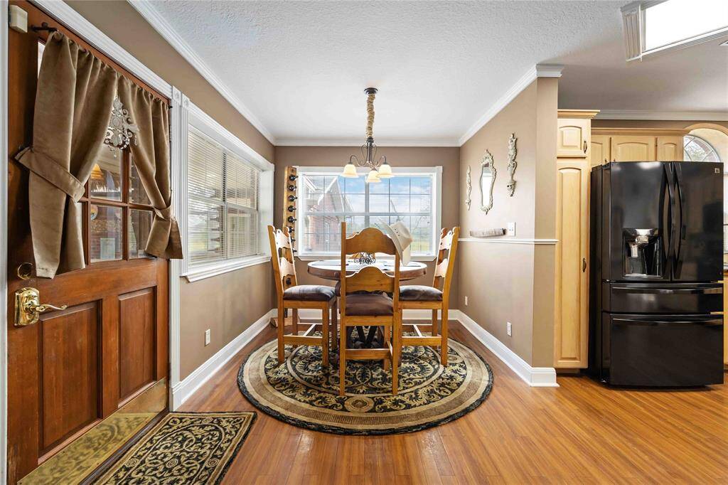 The breakfast room overlooks the kitchen, living and looks into the backyard.