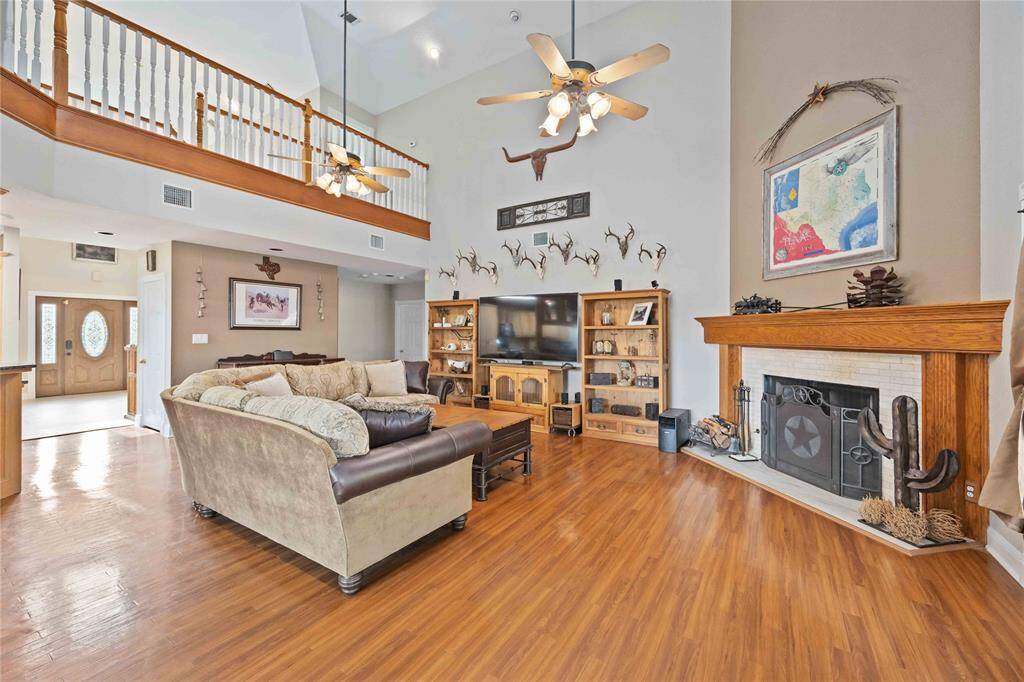 This home offers high ceilings, crown molding, gas wood burning fireplace, wood laminate flooring. Did you see that mantle?  You can put so many Christmas stocking on it!