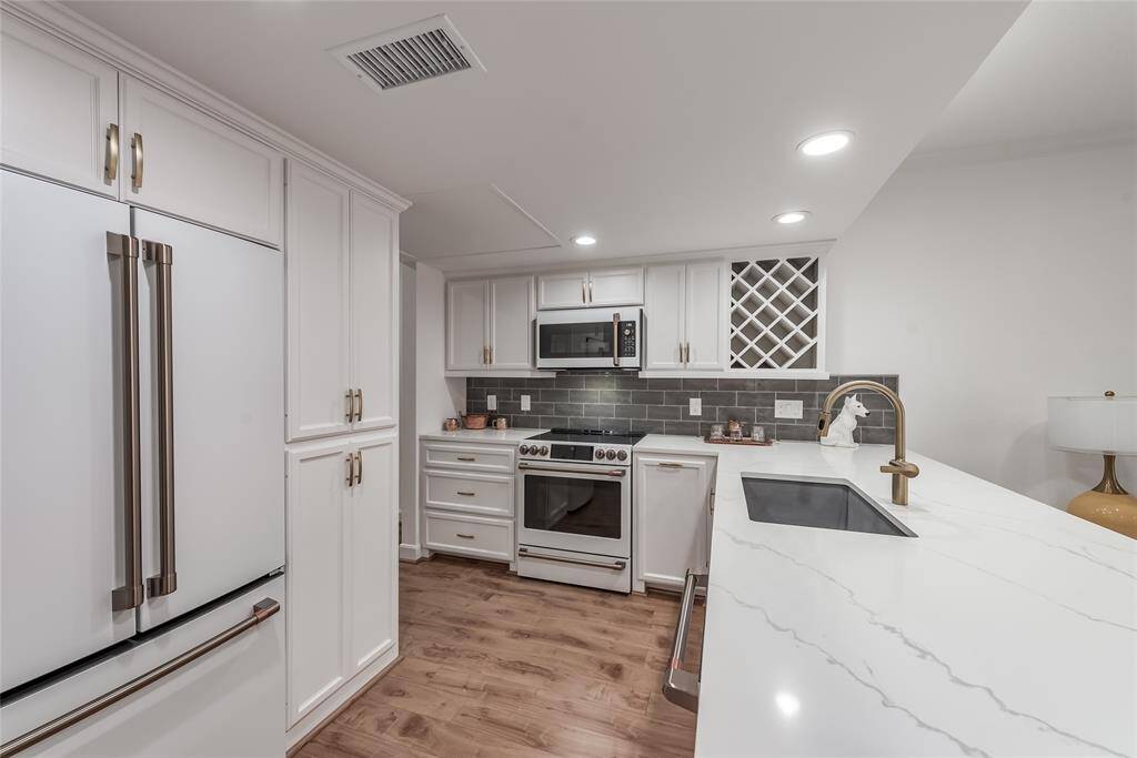 New kitchen with CAFE GE appliances and bronze handles. Plenty of drawers and cabinets.