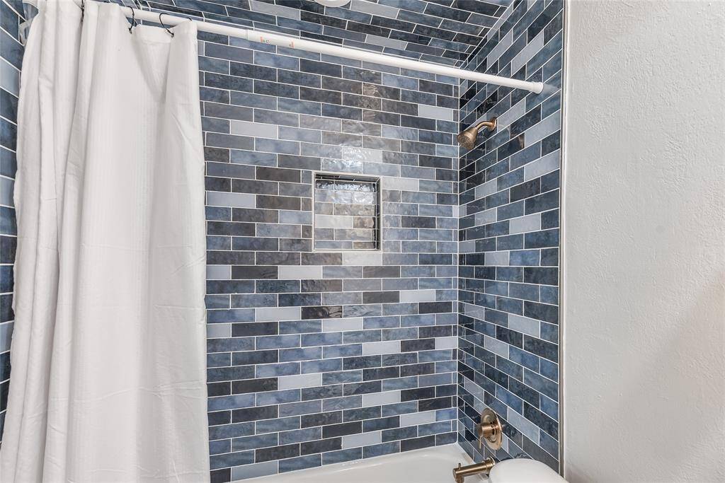 New tub, tile, and fixtures