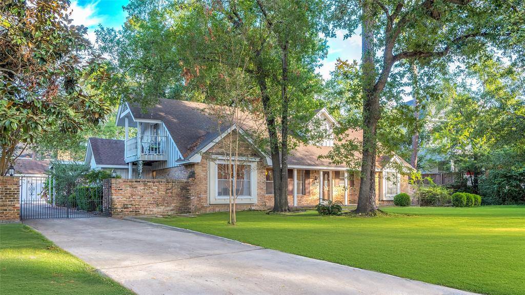 Featuring a spacious driveway with gate and 3 car garage, this home maximizes it's natural views with long porch, cozy balcony and multiple back patio spaces.