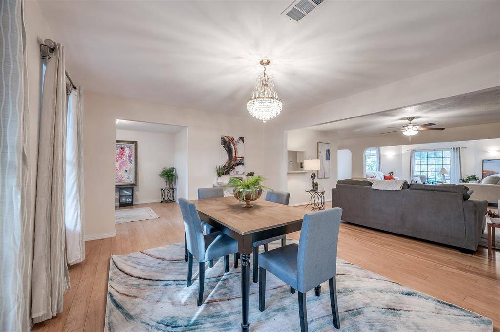 Another angle of the formal dining area that opens to both the den area and study space- flooded in natural light.
