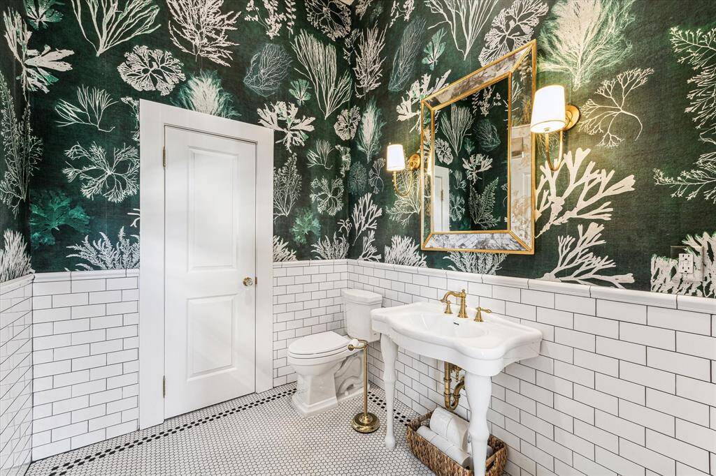 Half Bath Located in Parlor 2. Romanian eco friendly wall paper, Toto Toilet, high end fixture and finishes.