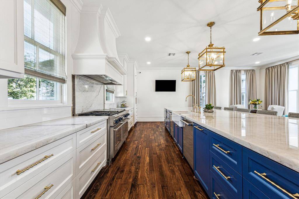 Kitchen: SS Thermador appliances includes Pro Grand® 60 Inch Wide 5.7 Cu. Ft. Slide In Dual Fuel Range with Double Griddle, 2 dishwashers, micro drawer, Freedom® Built-in Refrigerator/freezer Column 30'' Panel Ready. Custom cabinets, 17.5 island w/storage, custom vent  hood, Rohl kitchen sink faucet, 36" Shaw single basin sink, Quartz counters, custom thermal panels w/French brass rods, SS wine fridge, high end fixtures, and finishes.
