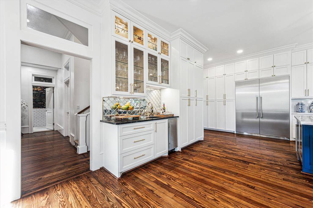 Wet bar: Custom cabinets, Rohl bar faucet, Scotchman Ice maker, and mercury mirror back splash