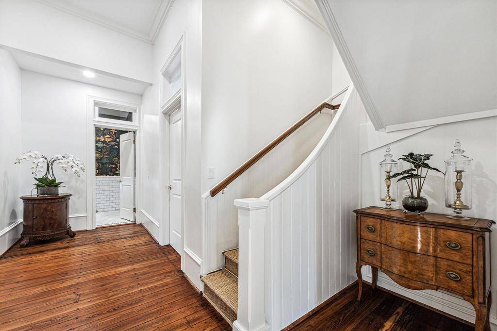 Refinished original Butler stairs w/Seagrass runner and brass runner rods.