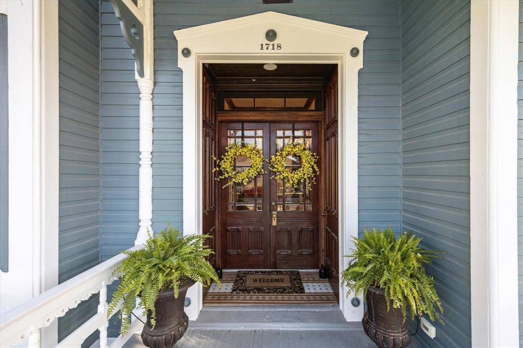 Original double storm doors and front entrance doors brought back to its original beauty. The original hardware has been restored and operable.