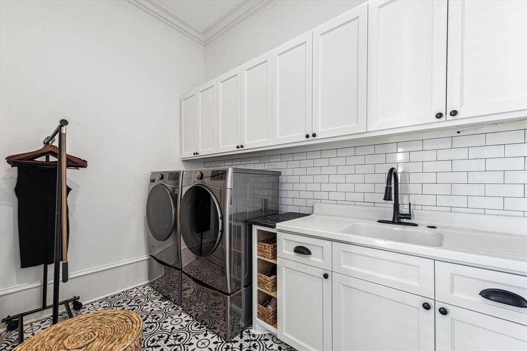 Laundry room w custom cabinets and LG washer/dryer.
