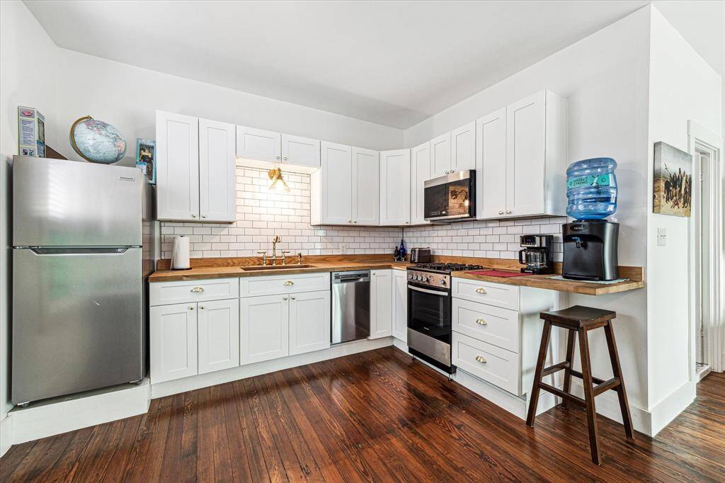 The 476 SF renovated carriage house. Tenant occupied.