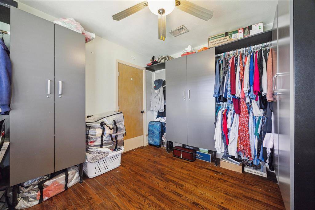 Bedroom one is located near the entrance of the home and connected to the primary bedroom. Makes for an amazing primary closet too!