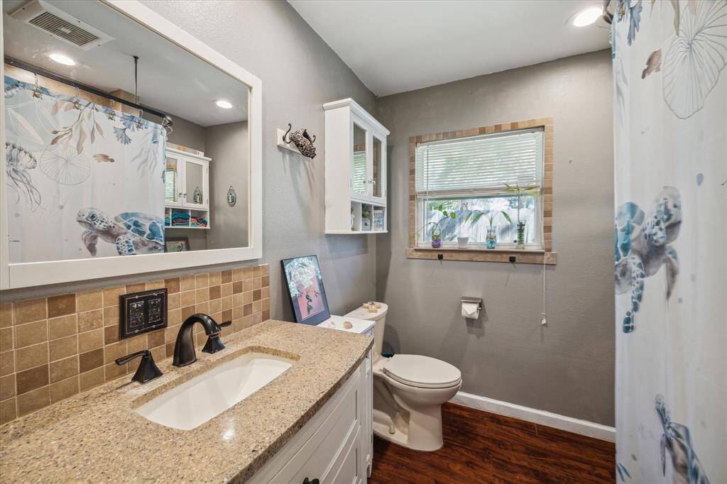 Bathroom includes like new vanity and vinyl flooring