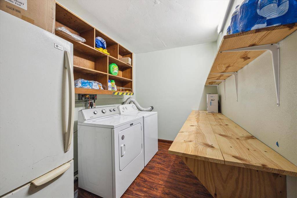 Closed in utility room in garage with lots of additonal storage! Outdoor refrigerator conveys!