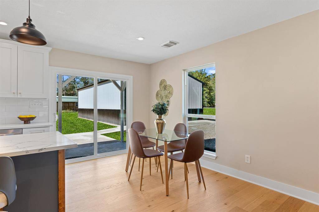The breakfast room features windows with views in your backyard.