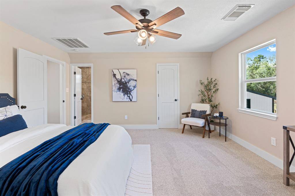 Step into the sanctuary of theprimary bedroom. Soft brand new carpetingunderfoot adds a touch of luxury,creating a warm and invitingatmosphere that extends throughoutthe space.