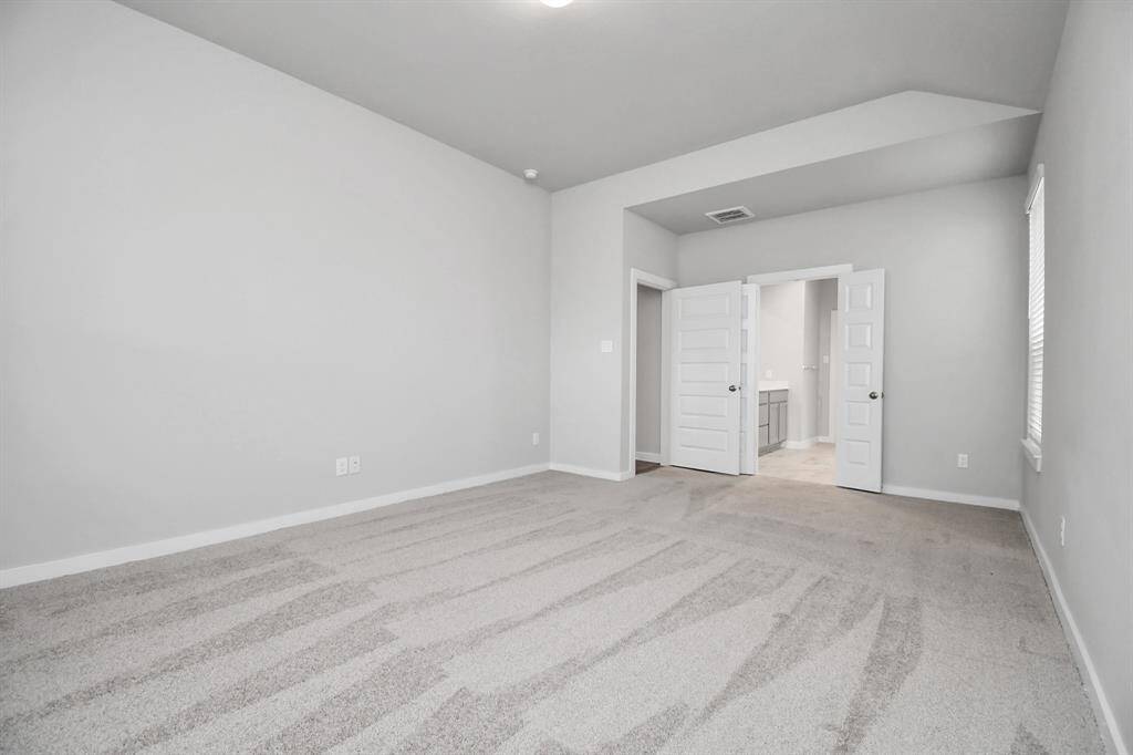 Come decompress in the stunning primary suite after a lengthy day! Experience the luxury of plush carpeting, warm paint hues, high ceilings, and large windows featuring privacy blinds. Virtual Staged