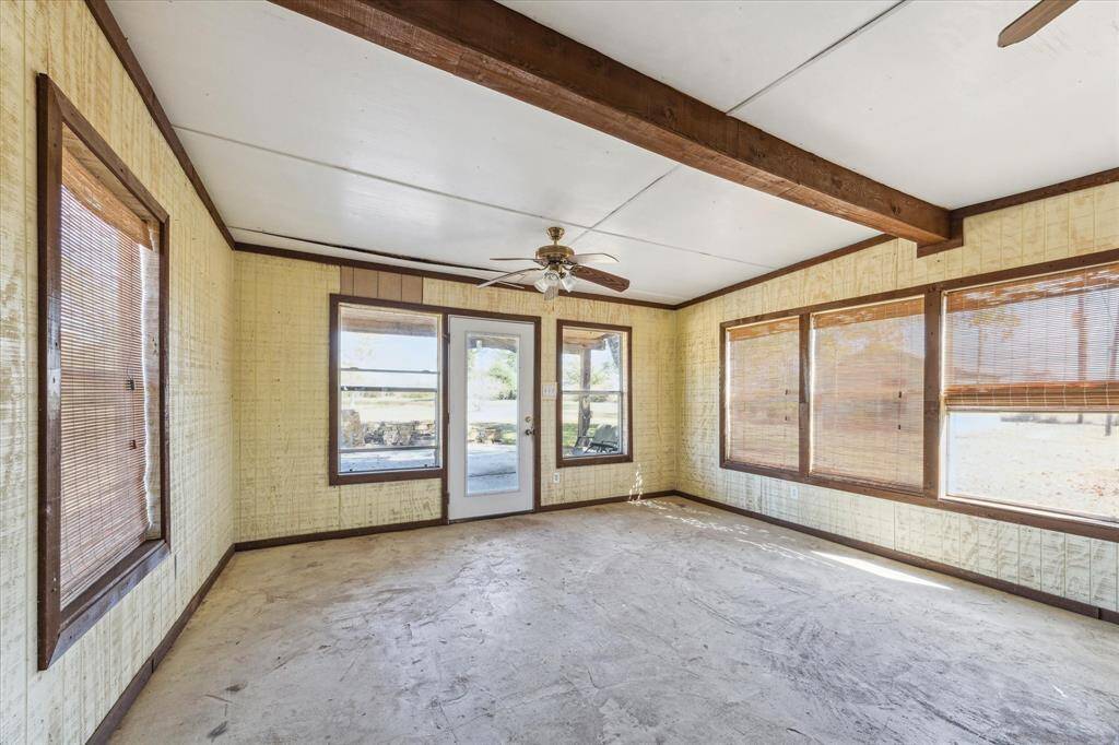 Enclosed sunroom off the back of the home.