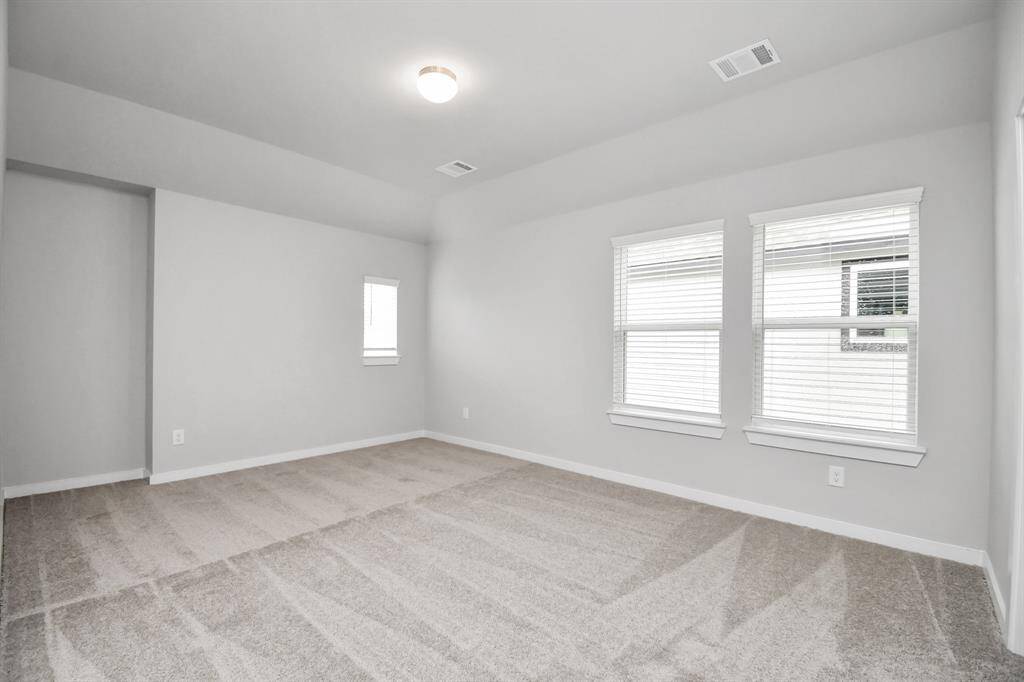 Come upstairs and enjoy a day of leisure in this fabulous game room! This is the perfect hangout spot or adult game room! Features plush carpet, high ceilings, custom paint and windows for plenty of natural light. Virtually Staged.