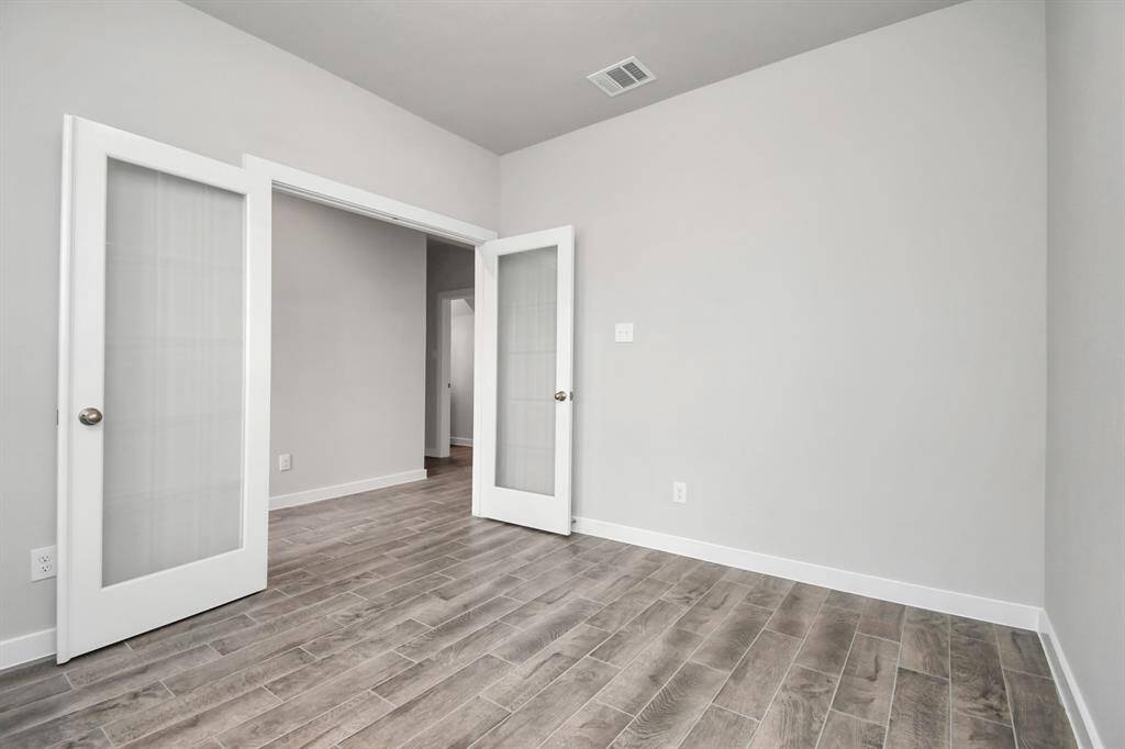 Quietly nestled in front of the home is the sophisticated home office.